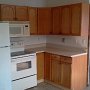 Part of the Light House kitchen, and view of the living room in the background.